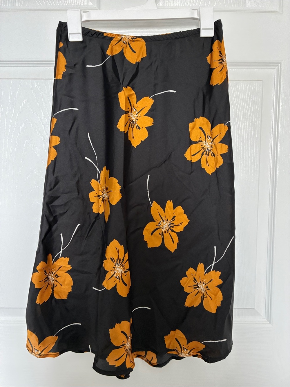 Sienna Sky Black Midi Skirt with Orange Floral Print